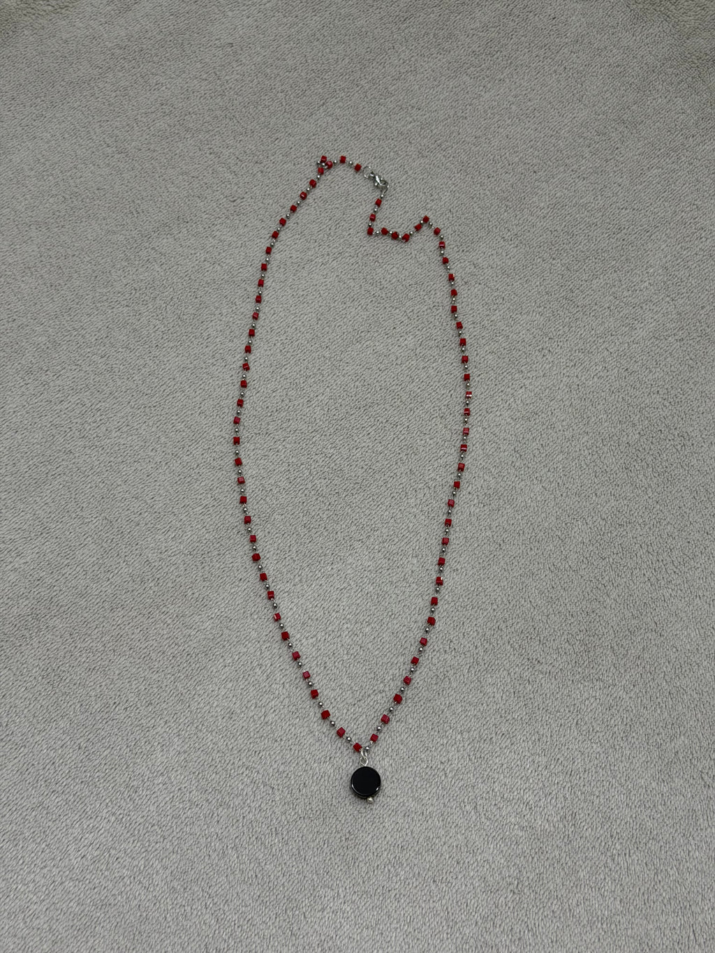 Stainless steel necklace with red beads