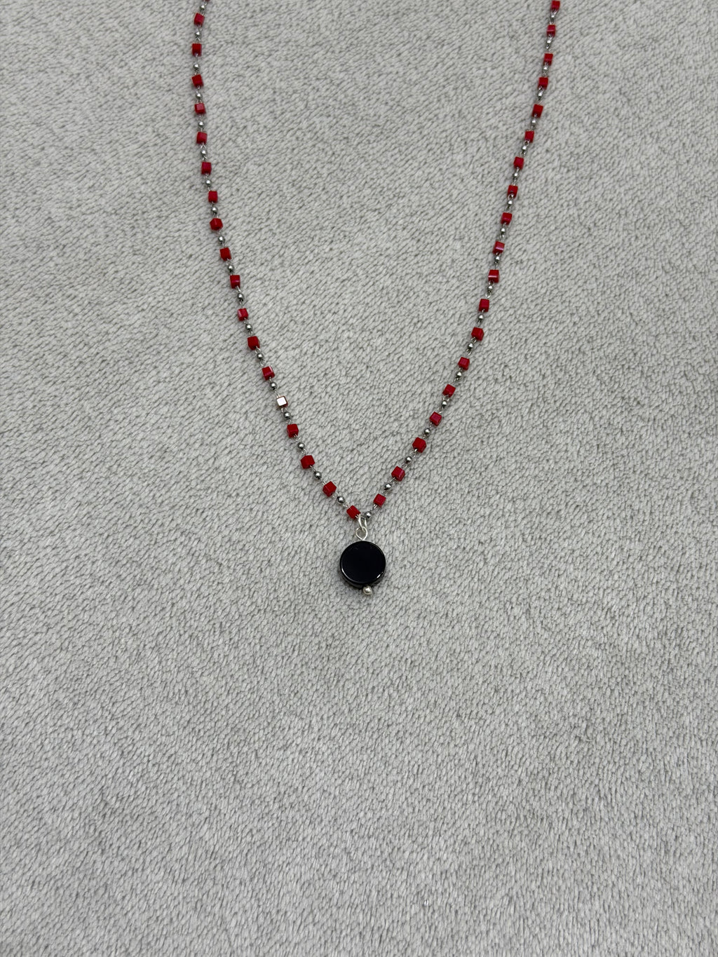Stainless steel necklace with red beads
